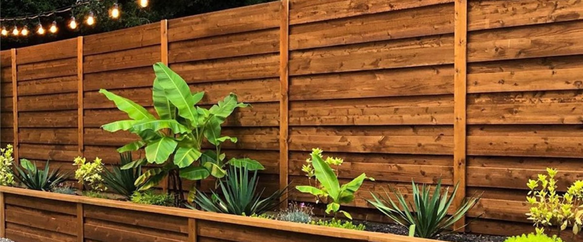 How A Wooden Privacy Fence Enhances Your Friendswood Residential Landscaping